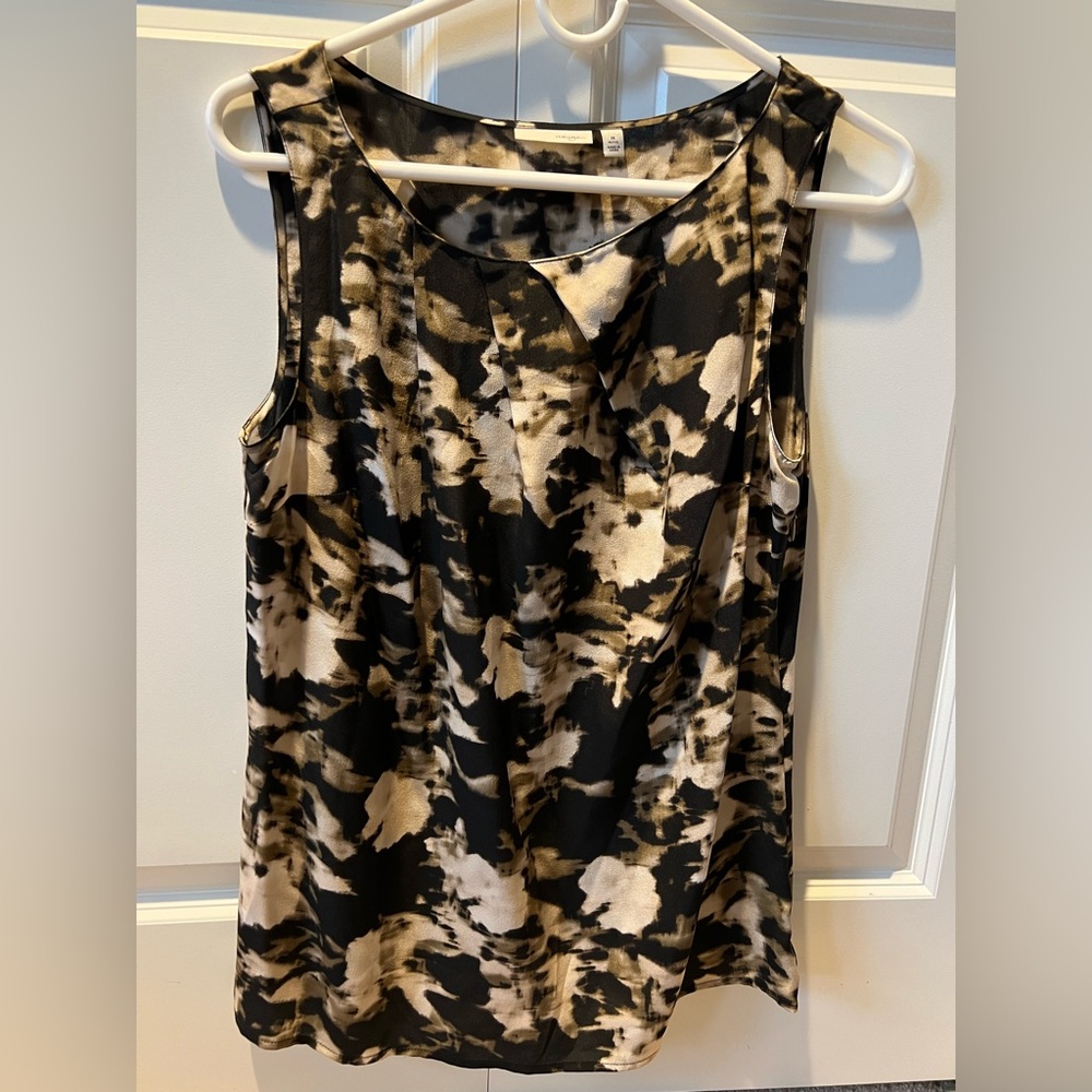 Women’s blouse.  Pleated front with side zipper.